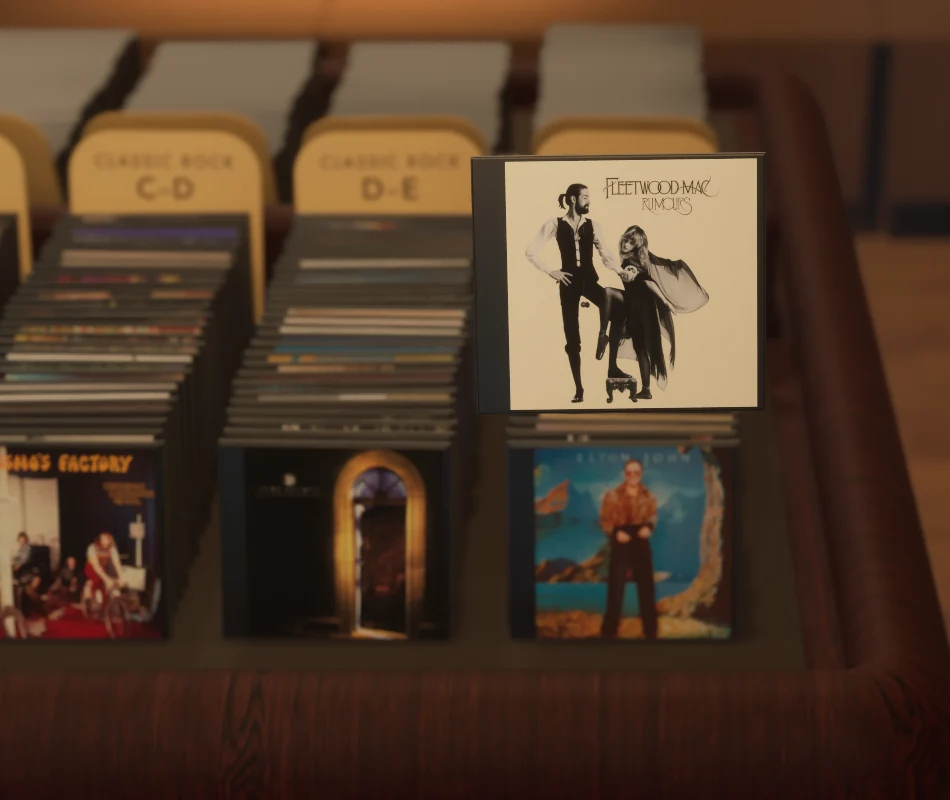 The prototype holding up a Fleetwood Mac Rumours jewel case in front of the album bins